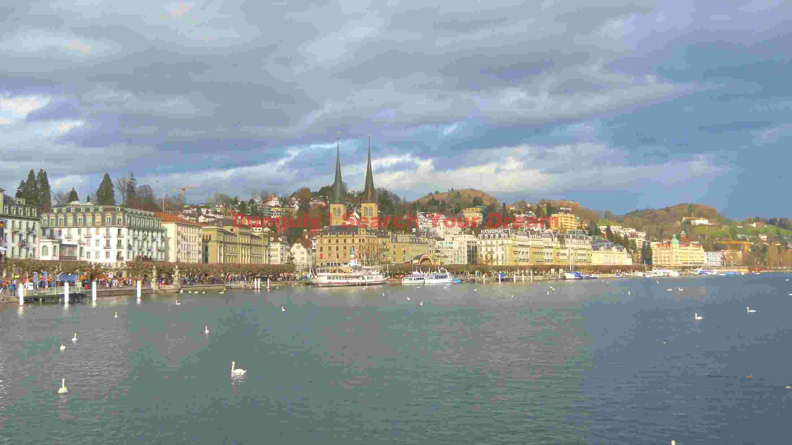 lakeside cityscape under dramatic skies lakeside cityscape under dramatic skies