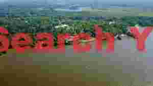 At Home lakeside forest retreat aerial vista