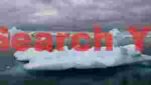 leopard seal resting on blue iceberg in antarctica