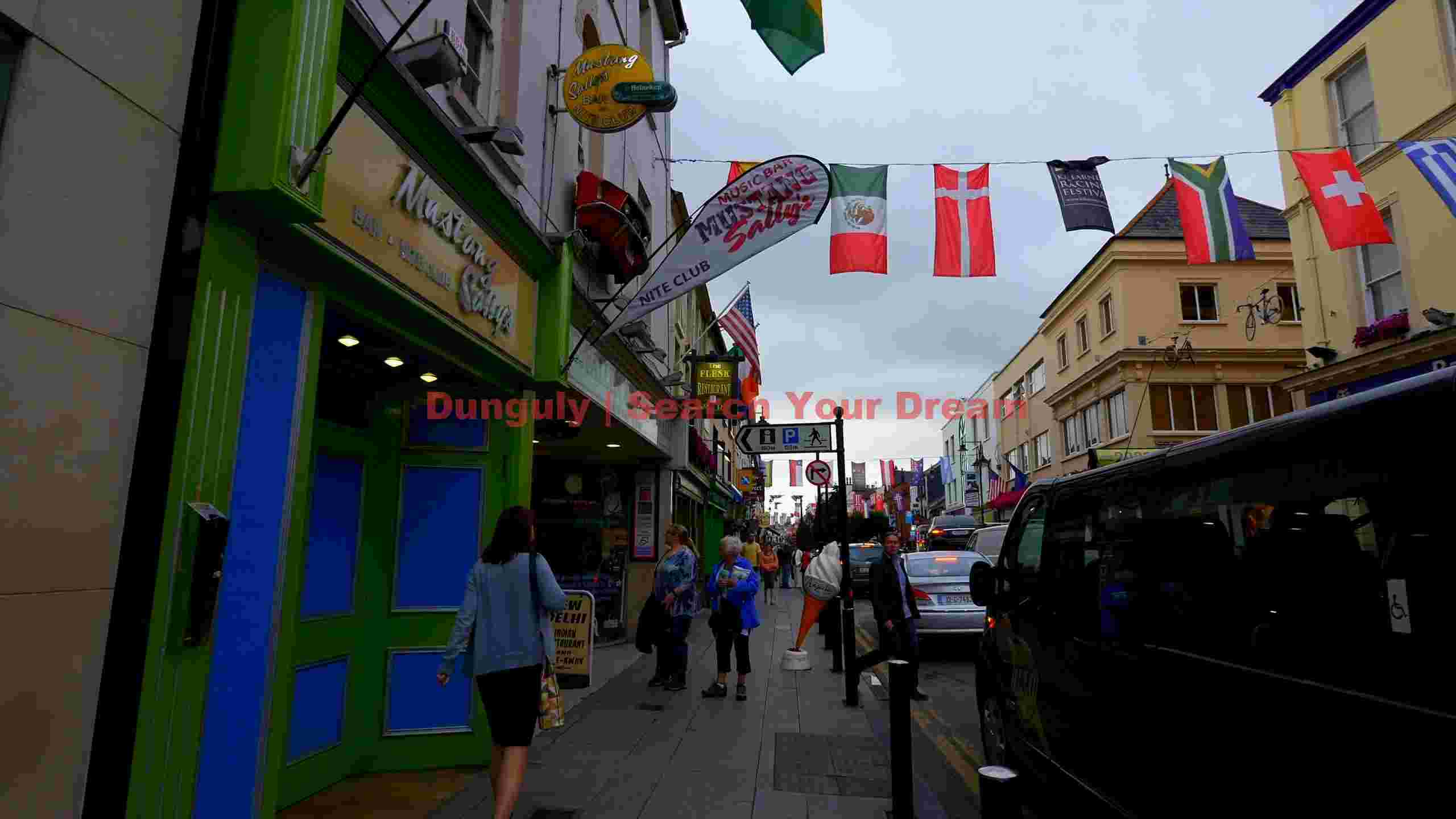 lively european street scene with international flags lively european street scene with international flags