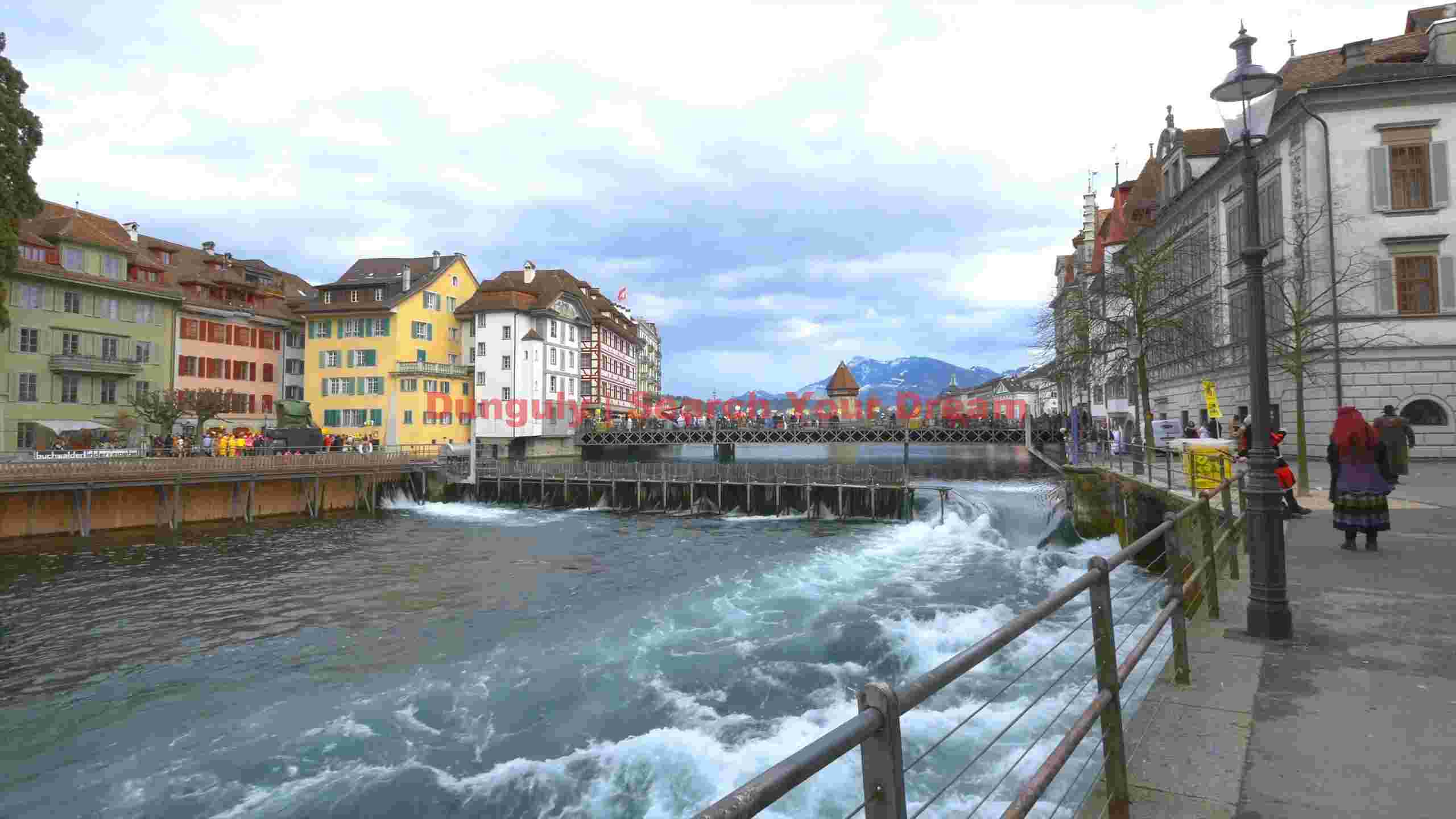 lucernes reuss river charm with historic bridge and alpine views lucernes reuss river charm with historic bridge and alpine views