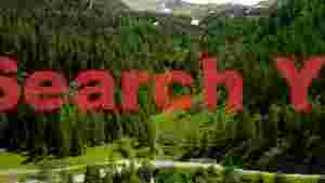 lush alpine valley with cascading waterfall