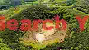 lush green volcanic crater from above