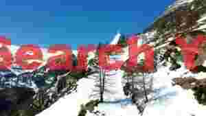 At Home majestic alpine peak and snowy slopes