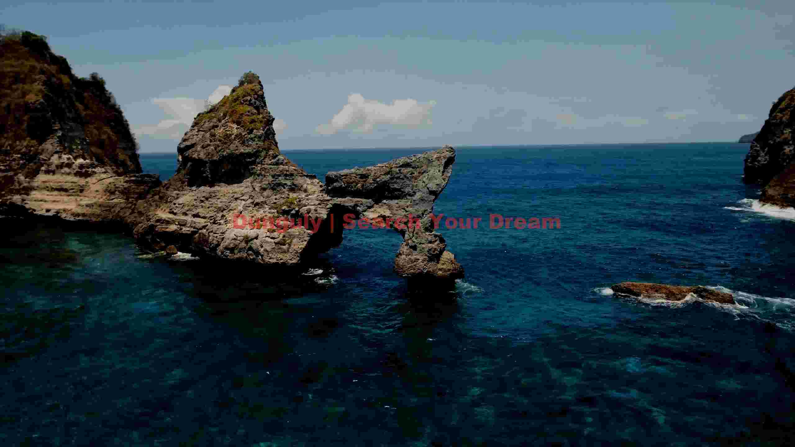 majestic natural rock arch at nusa penida coastline majestic natural rock arch at nusa penida coastline