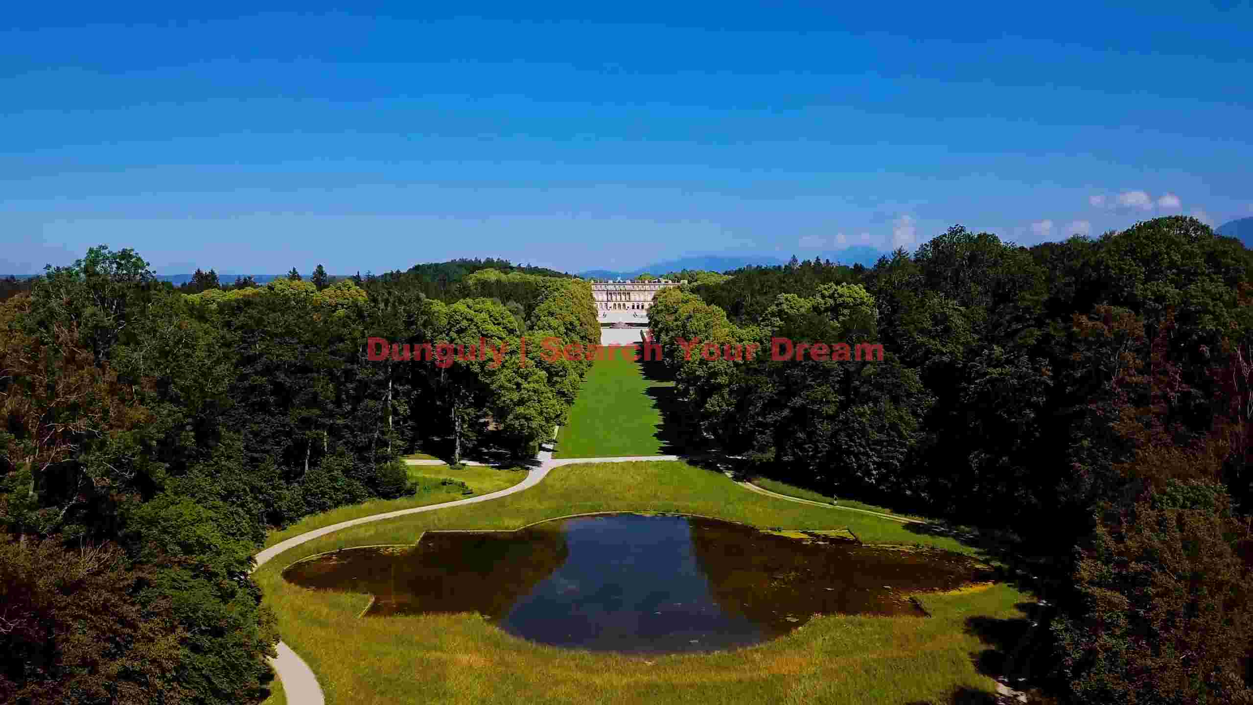 majestic palace gardens and serene pond aerial view majestic palace gardens and serene pond aerial view