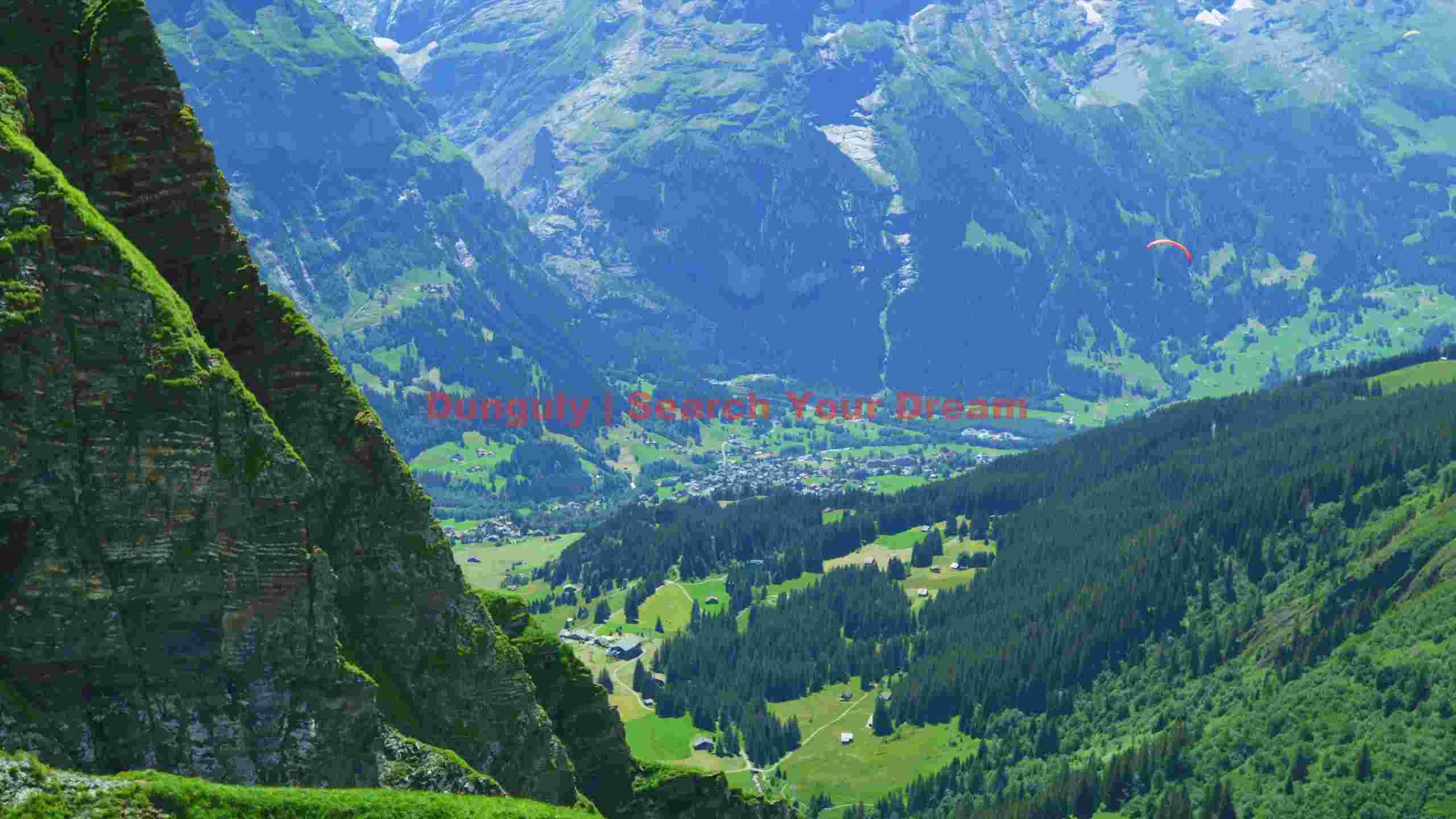 majestic swiss alpine valley with paraglider majestic swiss alpine valley with paraglider