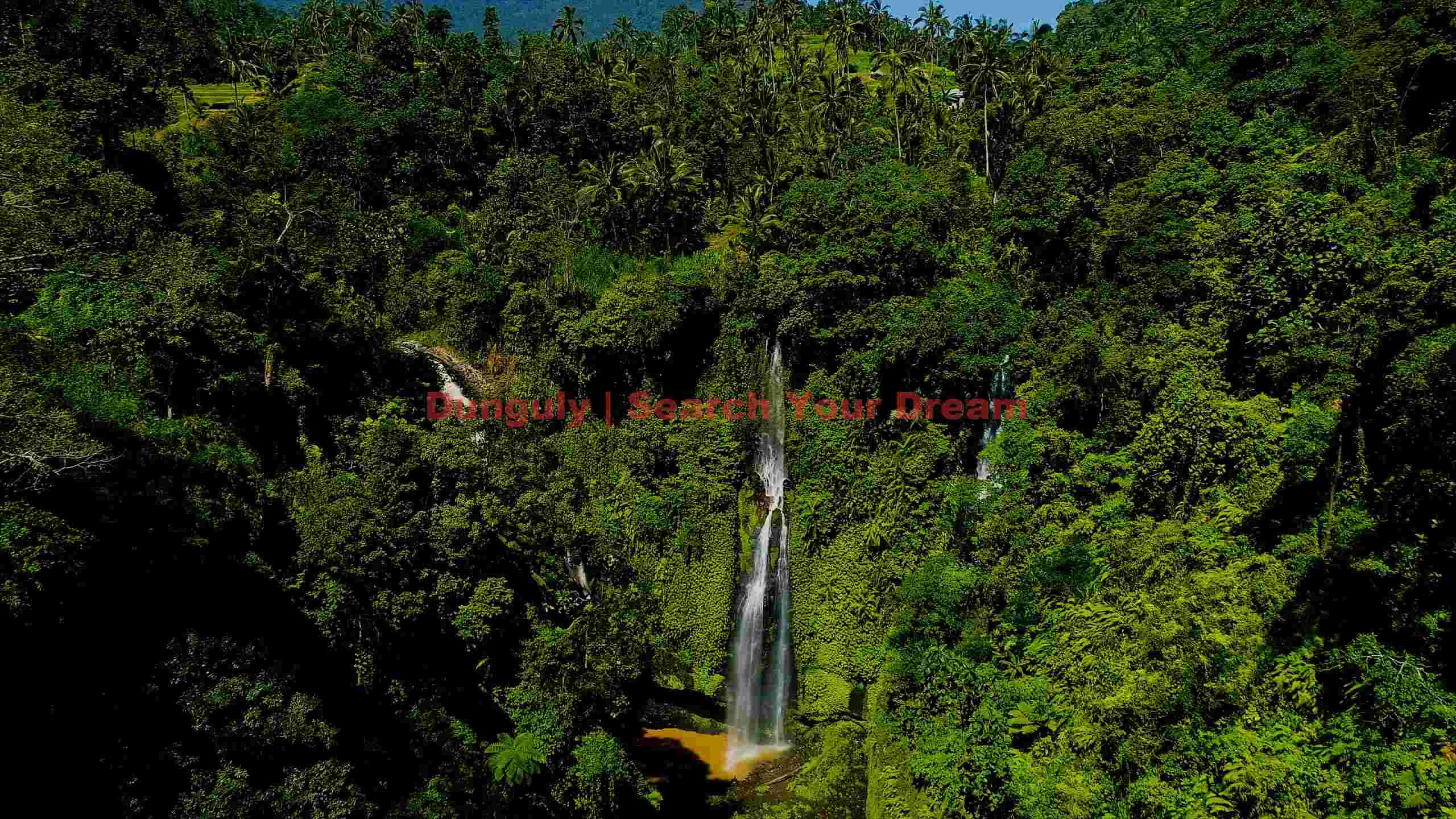 majestic tropical waterfall in lush rainforest majestic tropical waterfall in lush rainforest