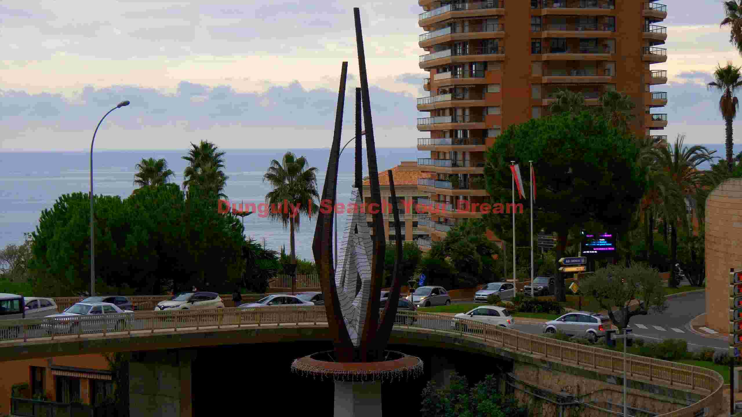 monaco coastal view with striking modern sculpture monaco coastal view with striking modern sculpture