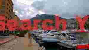 At Home monaco marina under cloudy skies