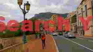 At Home monaco street scene with mountain vista