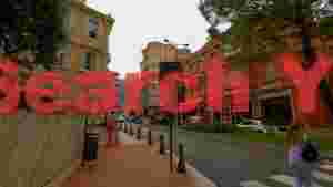 At Home monaco street vibrant buildings and daily life