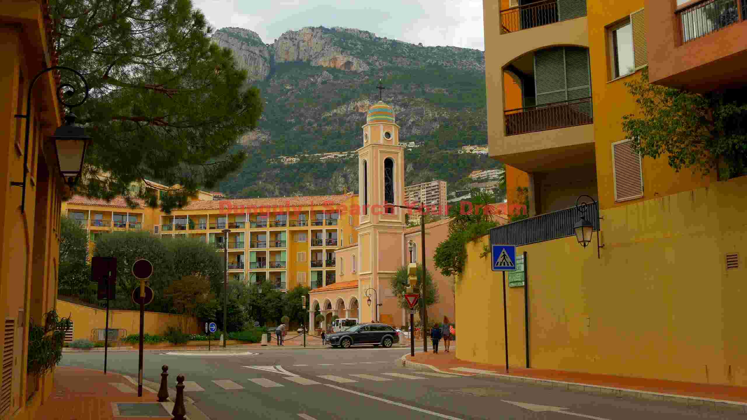 monte carlo street scene with mountain vista monte carlo street scene with mountain vista