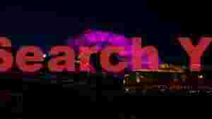 neon purple canopy over urban waters
