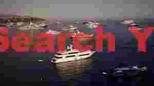opulent yachts anchored off the mediterranean coast
