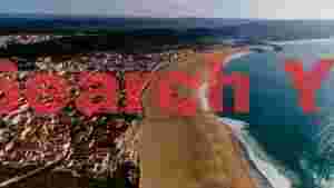 At Home panoramic coastal town and sandy beach aerial
