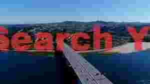 panoramic river crossing to a vibrant cityscape