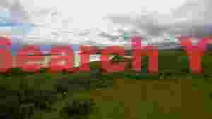 panoramic scottish coastal landscape with distant isle