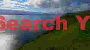 panoramic scottish coastline with shimmering sea