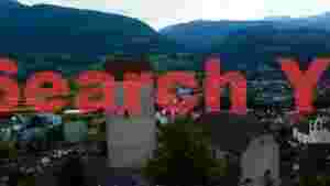 At Home panoramic view of historic alpine valley town