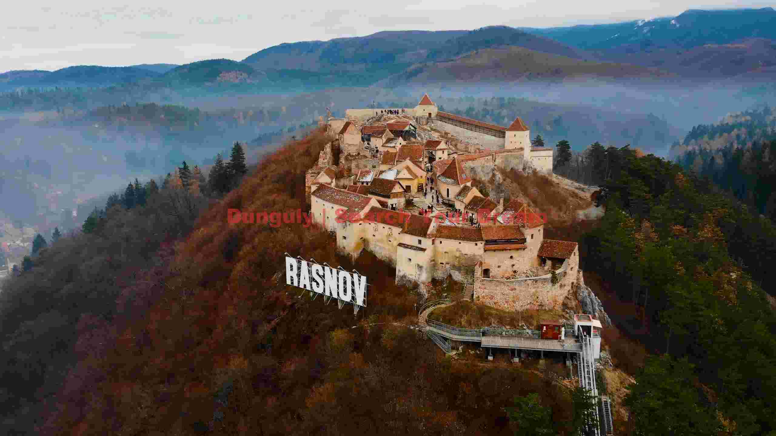 rasnov fortress perched on misty autumn hills rasnov fortress perched on misty autumn hills