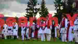 romanian folk dancers in traditional attire