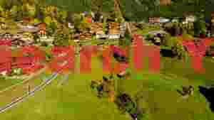 scenic alpine village in autumn with train