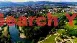 At Home scenic river town amidst lush green mountains