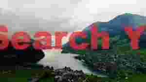 serene alpine lake village under cloudy skies
