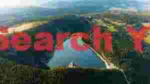 serene mountain lake and verdant forest landscape