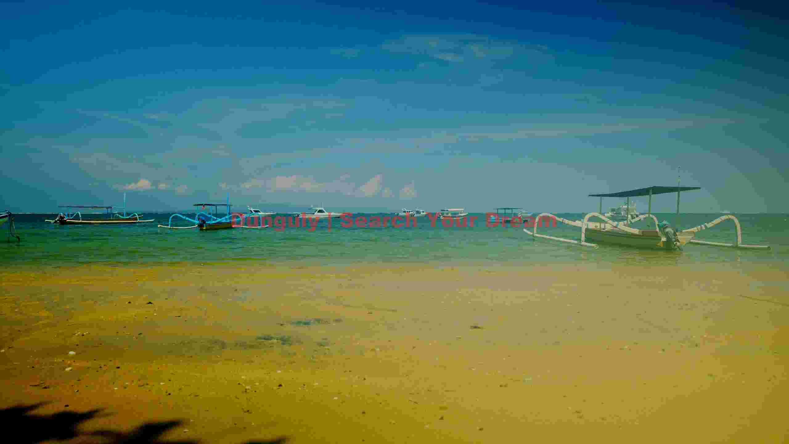 serene tropical beach with traditional outrigger boats serene tropical beach with traditional outrigger boats
