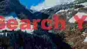 At Home snowy alpine valley with scenic bridge