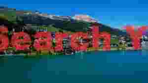 stunning alpine lake and mountain village view