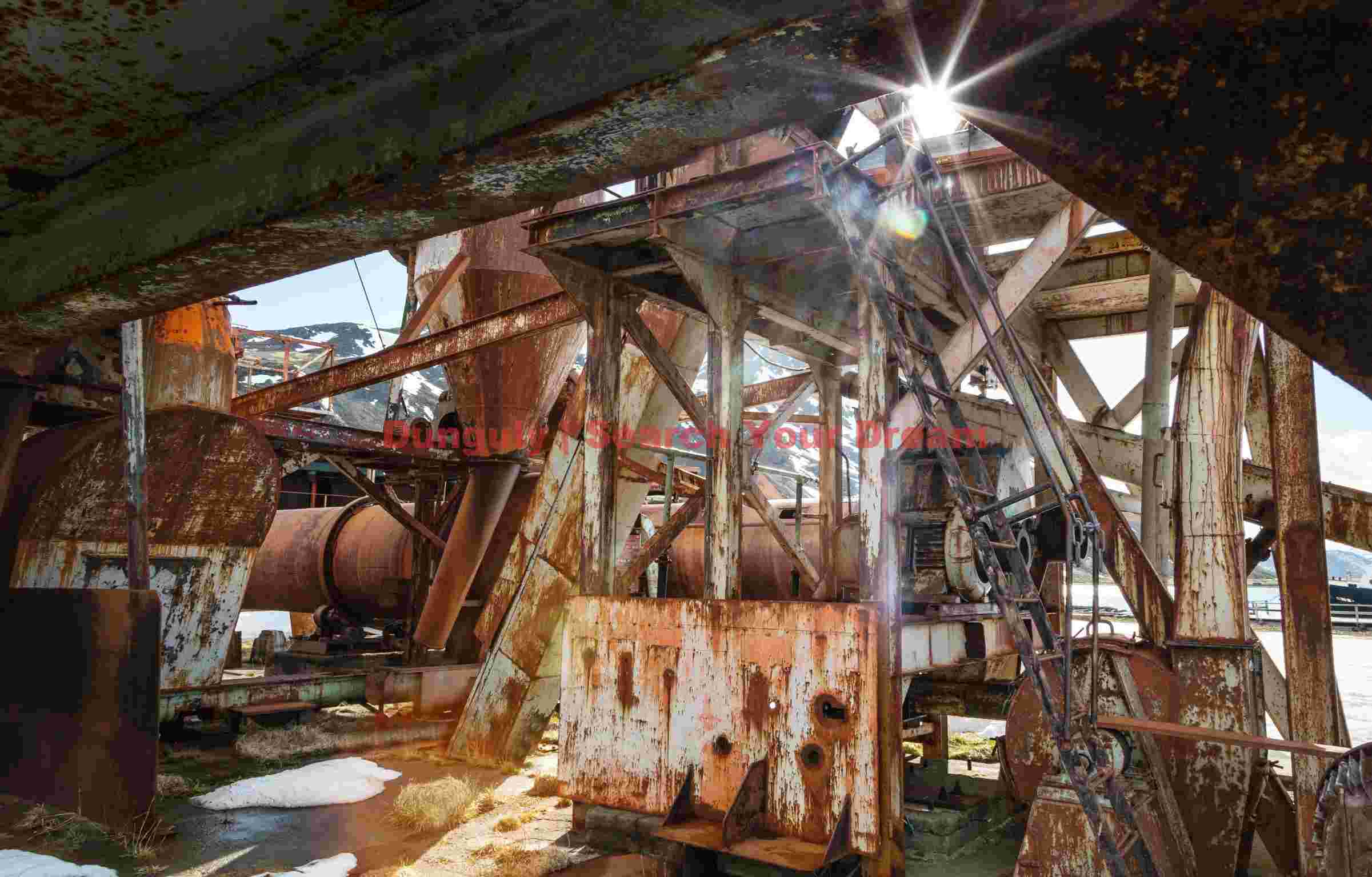 sun kissed industrial relics in a snowy landscape sun kissed industrial relics in a snowy landscape