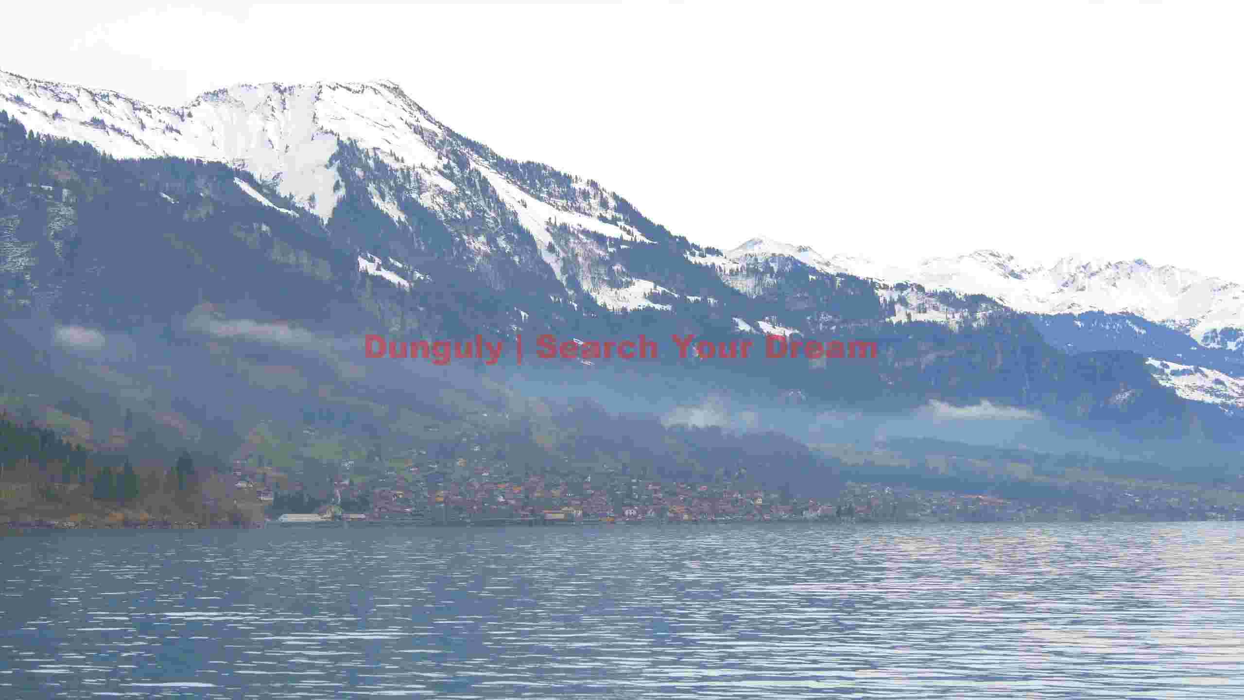 swiss alpine lake and snow capped mountains swiss alpine lake and snow capped mountains