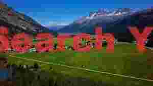 swiss alpine panorama with turquoise lake