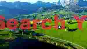 At Home swiss alpine valley with lakeside village