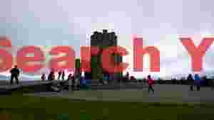 tourists at obriens tower cliffs of moher