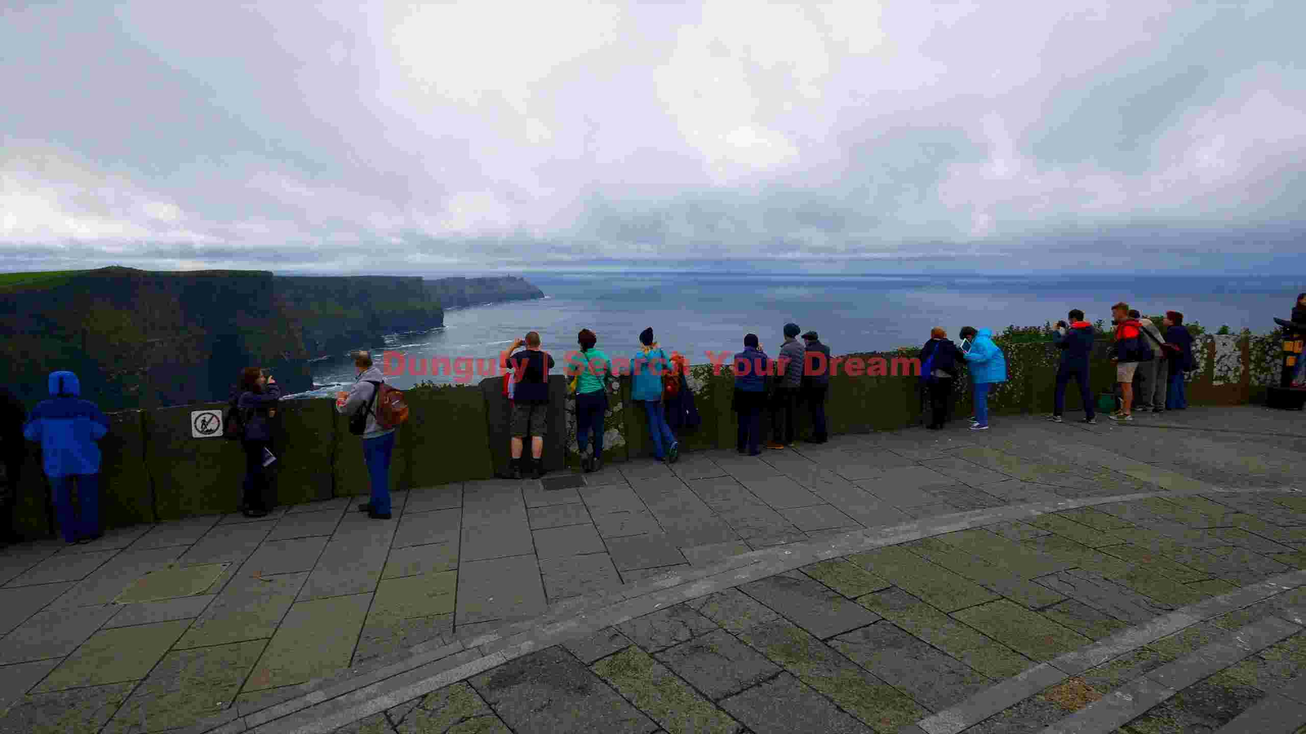 tourists at the majestic cliffs of moher ireland tourists at the majestic cliffs of moher ireland