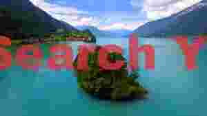 turquoise alpine lake and lakeside village