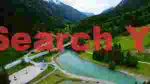 turquoise river winding through alpine valley