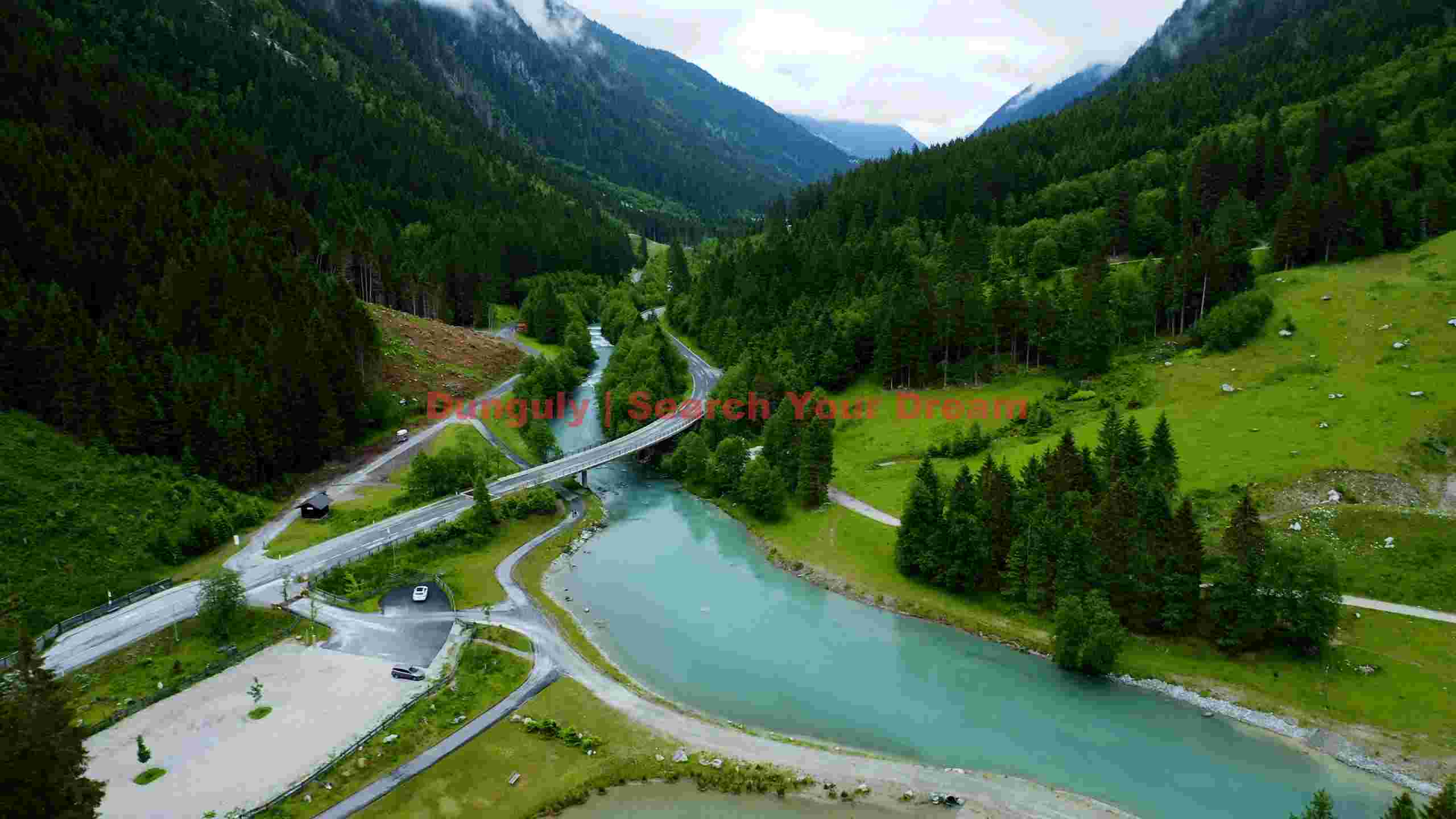 turquoise river winding through alpine valley turquoise river winding through alpine valley