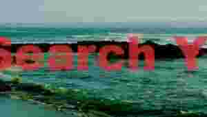 At Home turquoise waves and rugged coastal rocks