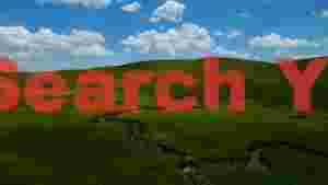 vast green rolling hills with winding stream