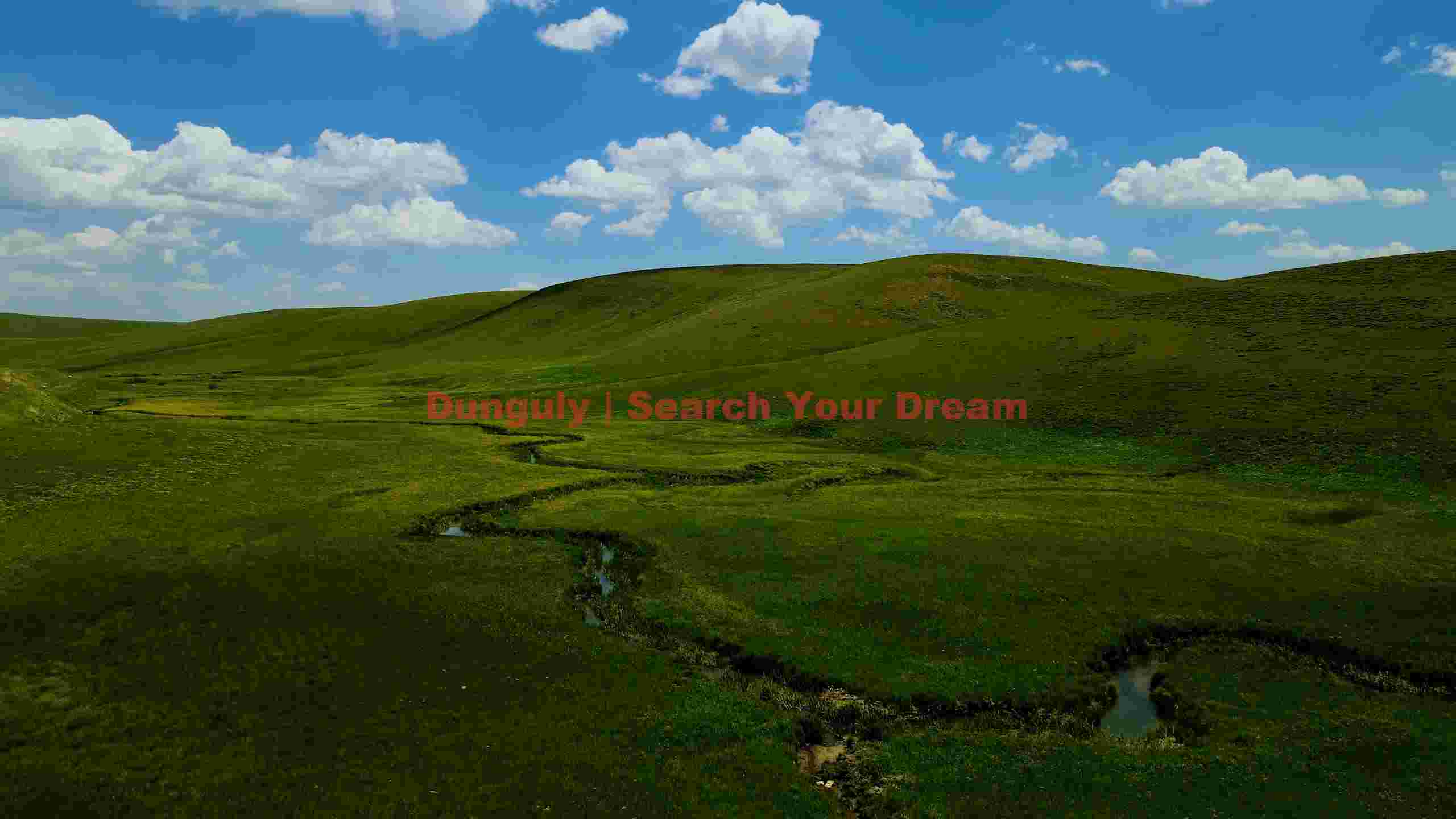 vast green rolling hills with winding stream vast green rolling hills with winding stream