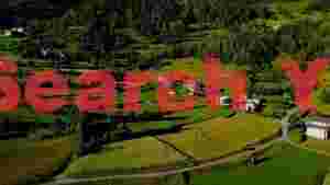 verdant alpine landscape with rural homes