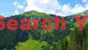 At Home verdant alpine peaks and cascading waterfalls
