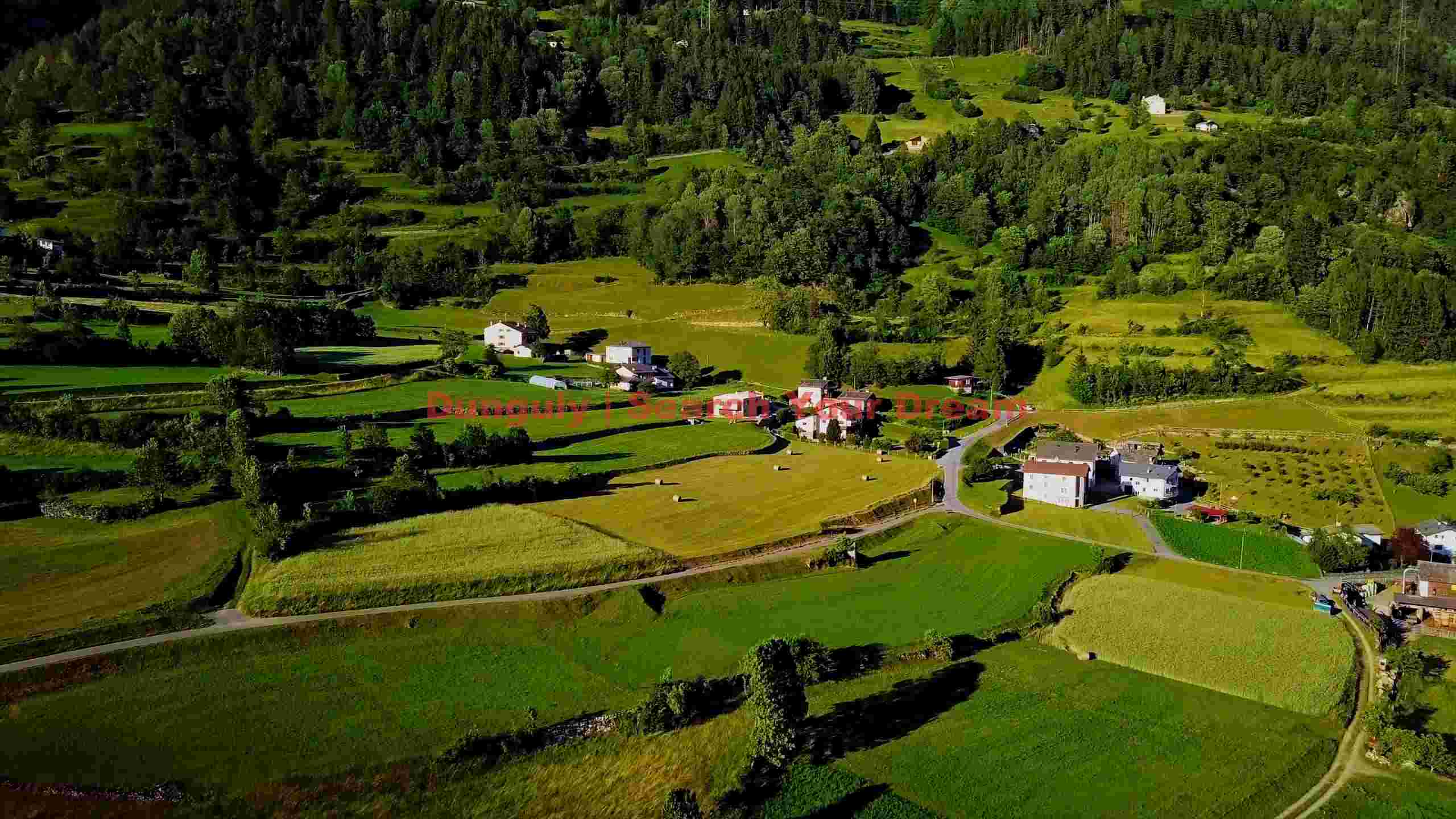 verdant valley panorama with rural homes verdant valley panorama with rural homes