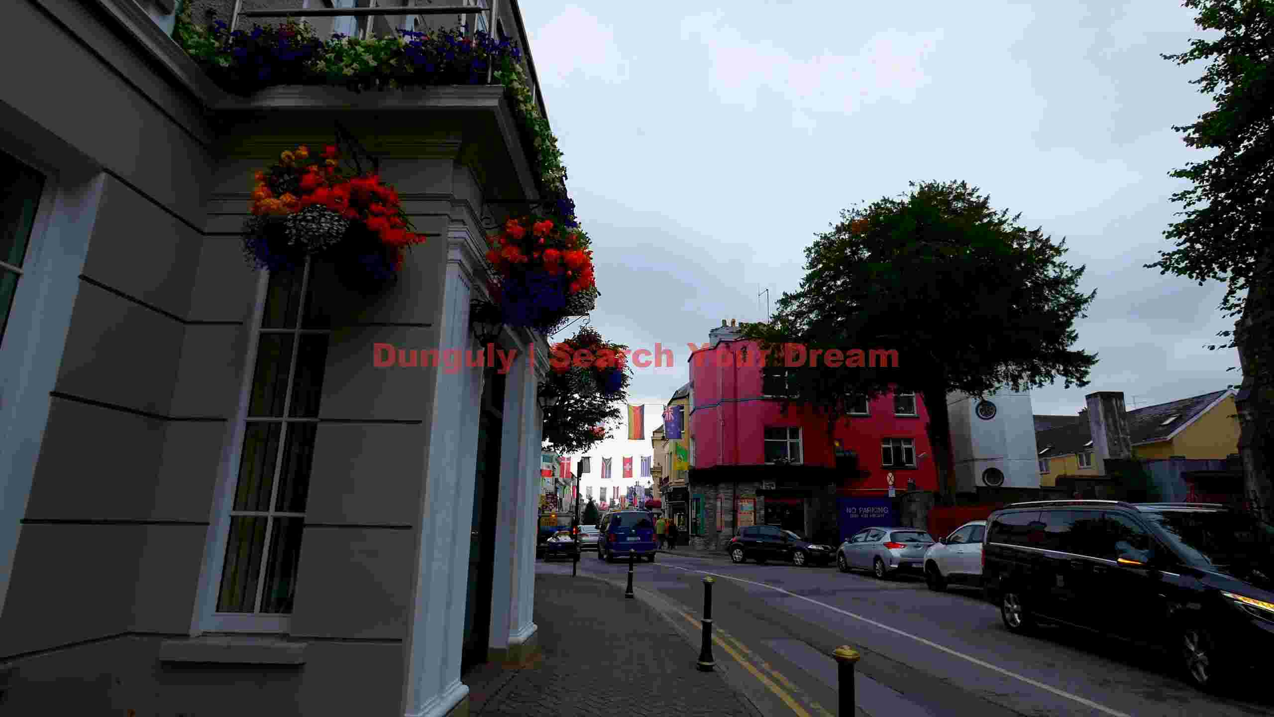 vibrant european street with blooming flower baskets vibrant european street with blooming flower baskets