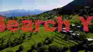vibrant green hills and distant peaks
